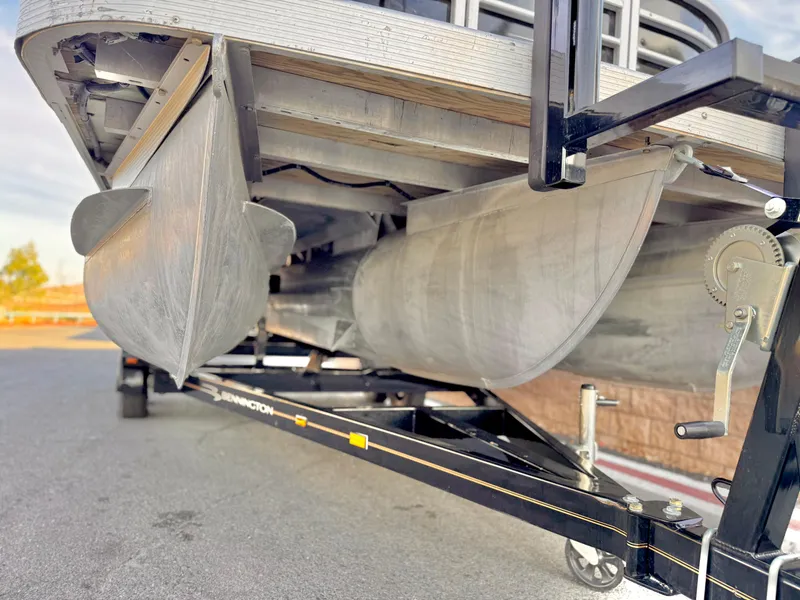 Slide: The Image of 2021 Bennington 23 LPD pontoon boat on trailer, close-up view of pontoons. - 3