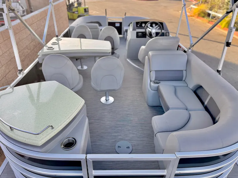 Slide: The Image of 2021 Bennington 23 LPD pontoon boat interior with plush seating and modern amenities. - 9