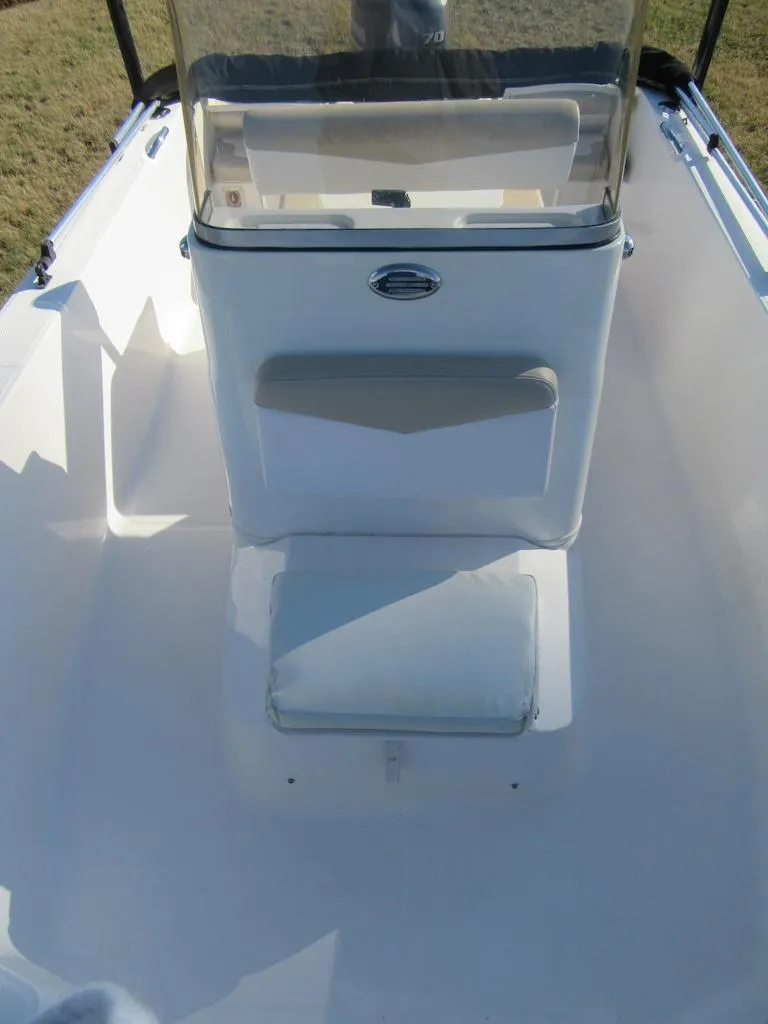Slide: The Image of 2016 Robalo R160 Center Console boat interior with seating and console. - 10