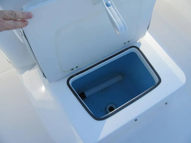 Slide: The Image of Open storage compartment on 2016 Robalo R160 Center Console boat. - 11