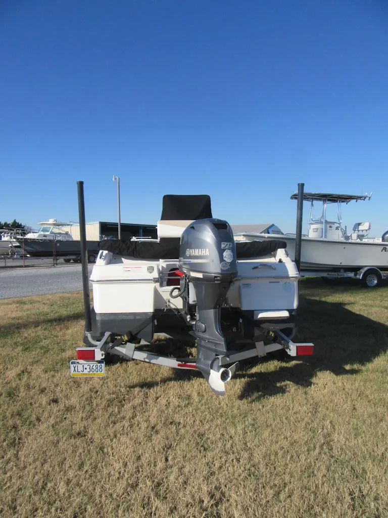Slide: The Image of 2016 Robalo R160 Center Console boat with Yamaha outboard motor on trailer. - 22