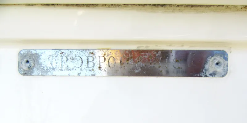 Slide: The Image of Robalo R160 Center Console 2016 metal nameplate with weathered appearance. - 4