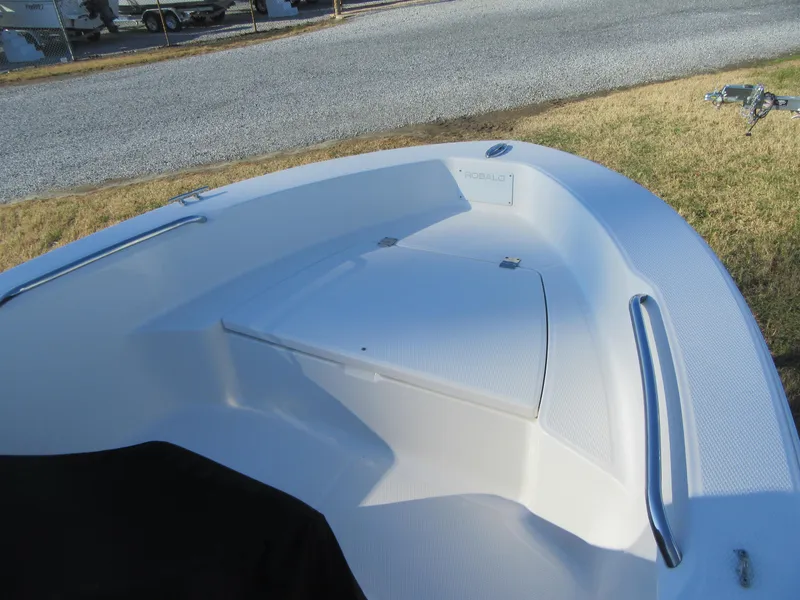 Slide: The Image of 2016 Robalo R160 Center Console boat interior with seating and storage. - 8