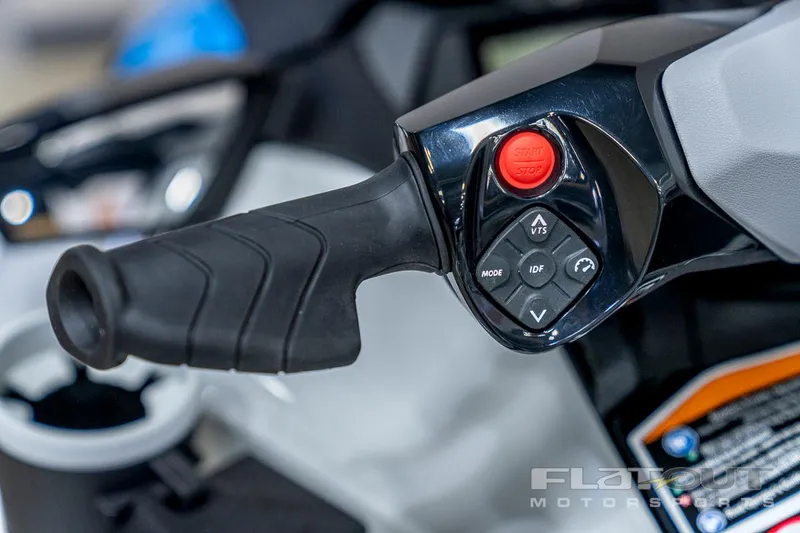 Slide: The Image of 2024 Sea-Doo Fish Pro 130 Scout handlebar controls, featuring ergonomic grip and buttons. - 16