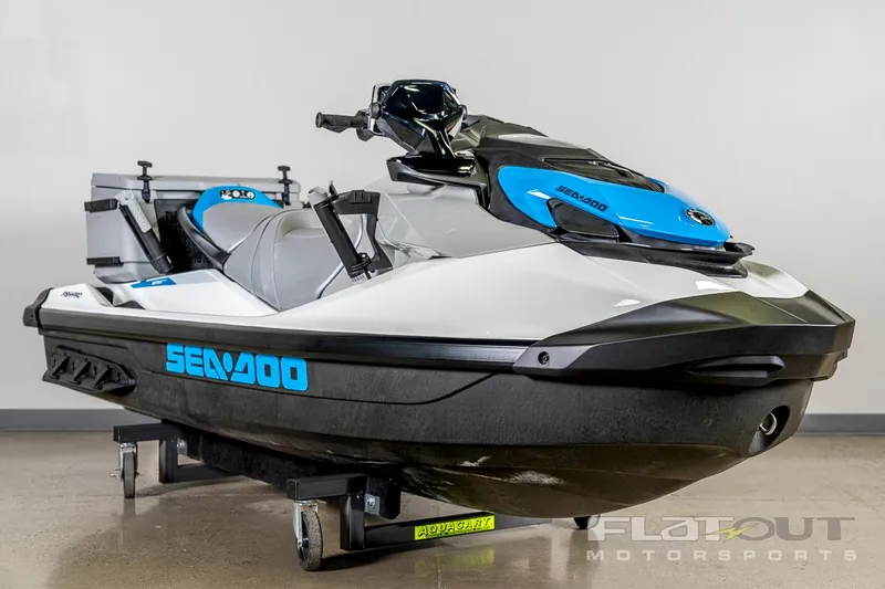 Slide: The Image of 2024 Sea-Doo Fish Pro 130 Scout jet ski, white and blue, displayed indoors. - 9