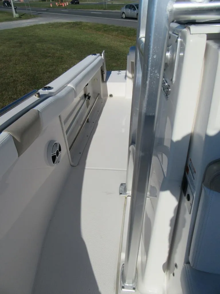 Slide: The Image of 2018 Robalo R222 Center Console boat interior, featuring sleek white deck and seating. - 10