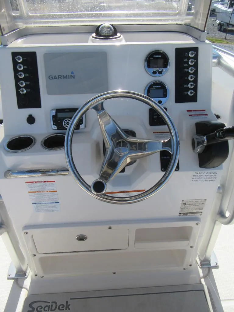 Slide: The Image of 2018 Robalo R222 Center Console dashboard with Garmin navigation system. - 12