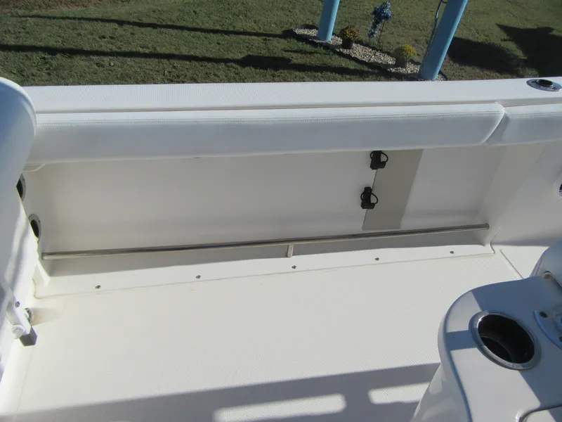 Slide: The Image of 2018 Robalo R222 Center Console boat interior with seating and cup holders. - 15