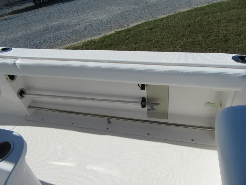 Slide: The Image of 2018 Robalo R222 Center Console boat interior with rod storage compartment. - 16