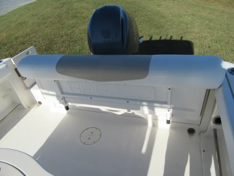 Slide: The Image of 2018 Robalo R222 Center Console boat interior with engine view. - 17