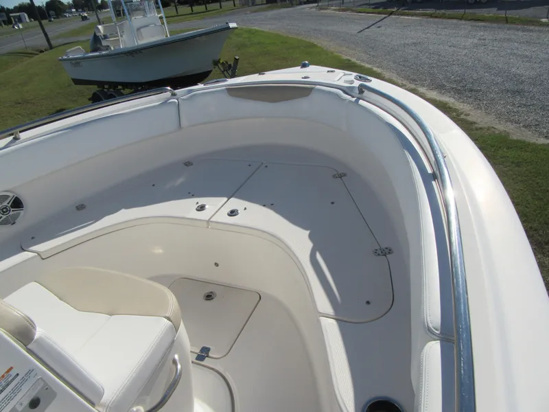 Slide: The Image of 2018 Robalo R222 Center Console boat interior with seating and storage compartments. - 4