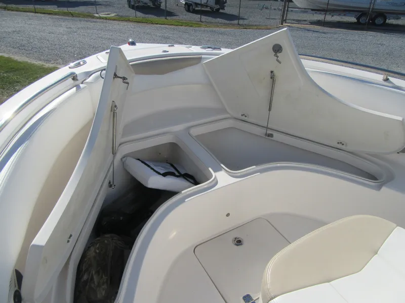Slide: The Image of 2018 Robalo R222 Center Console boat with open storage compartments. - 8