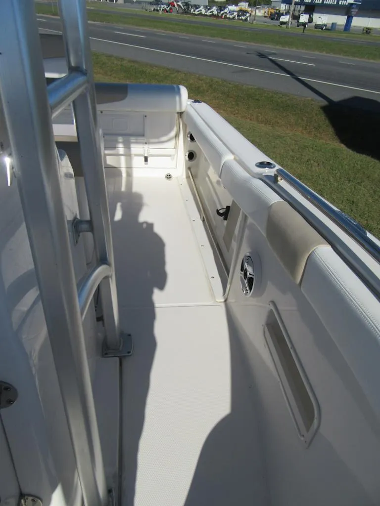 Slide: The Image of 2018 Robalo R222 Center Console boat interior, showing side deck and seating area. - 9