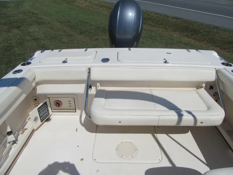 Slide: The Image of 2017 Grady-White 225 Freedom boat interior with seating and engine view. - 11