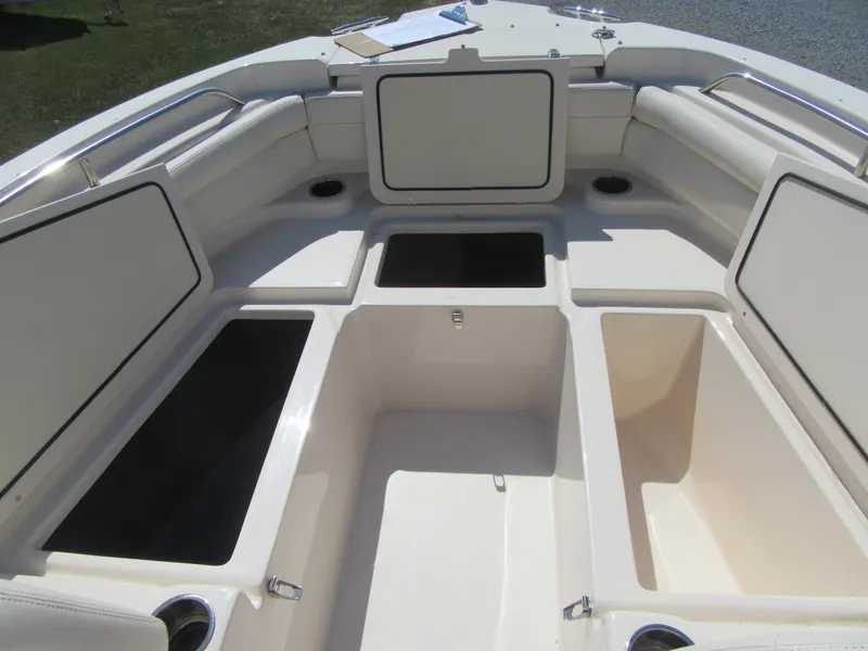 Slide: The Image of 2017 Grady-White 225 Freedom boat interior with open storage compartments. - 25