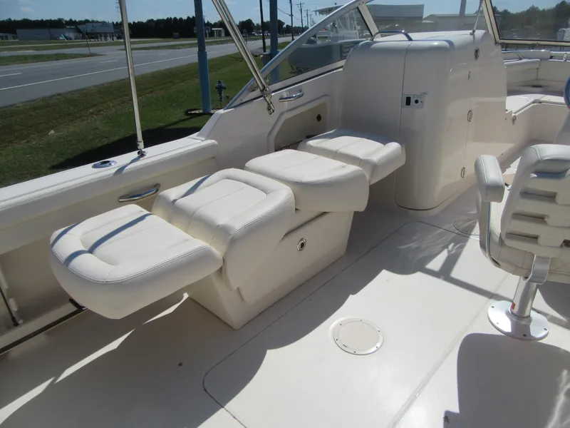 Slide: The Image of 2017 Grady-White 225 Freedom boat interior with white seating and helm. - 27