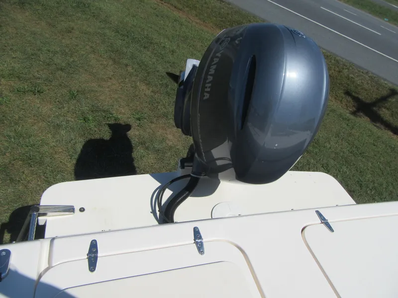 Slide: The Image of 2017 Grady-White 225 Freedom boat with Yamaha outboard motor on grassy area. - 8