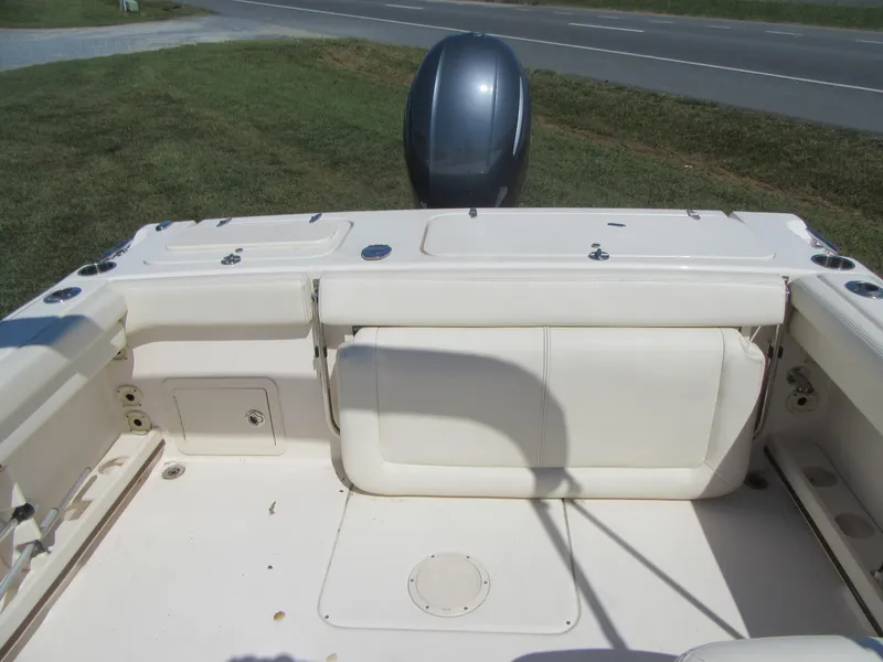 Slide: The Image of 2017 Grady-White 225 Freedom boat interior with seating and motor view. - 9