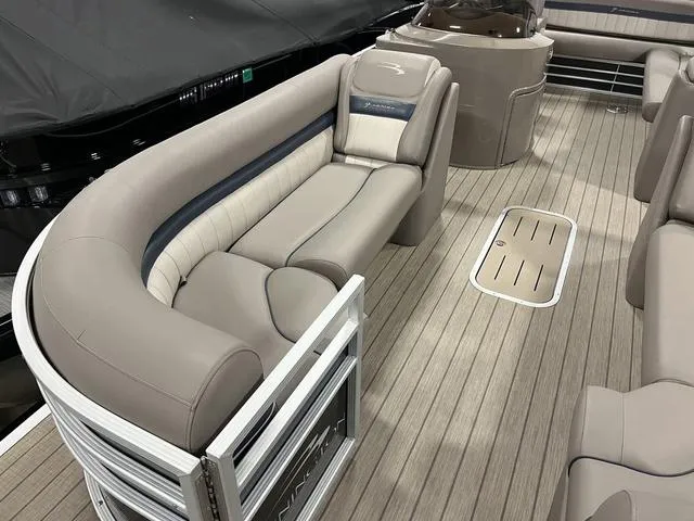 Slide: The Image of 2018 Bennington 25GSB pontoon boat interior with plush seating and wood-style flooring. - 15