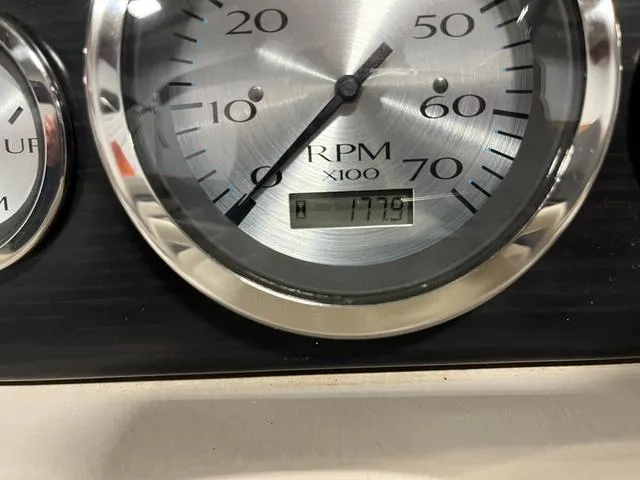 Slide: The Image of Close-up of 2018 Bennington 25GSB RPM gauge displaying 177.9 hours. - 17