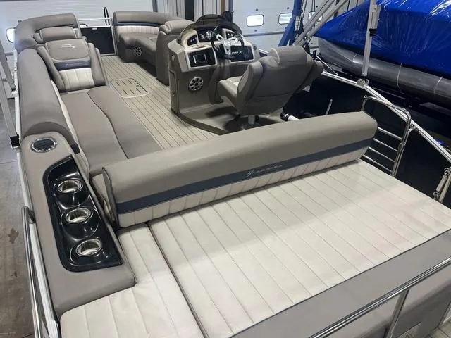 Slide: The Image of 2018 Bennington 25GSB pontoon boat interior with plush seating and modern helm. - 6