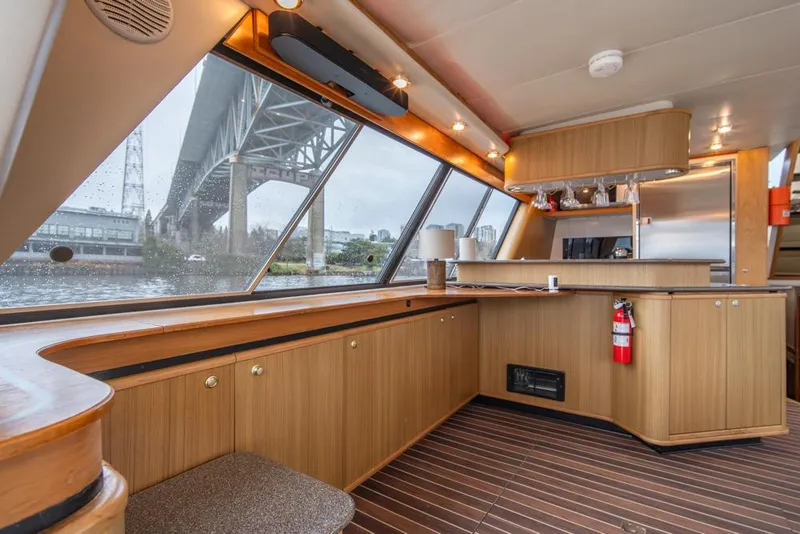Slide: The Image of Interior of 2000 Bayliner 4788 Pilot House Motoryacht with wood finish and large windows. - 14