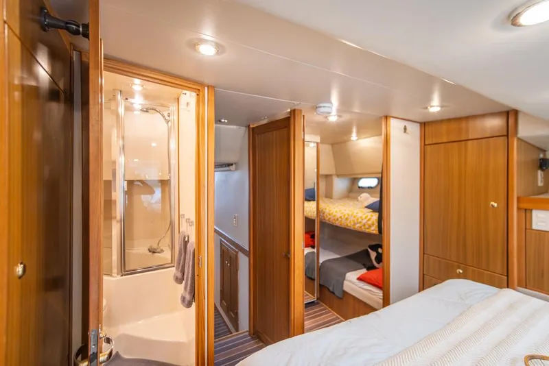 Slide: The Image of Interior of 2000 Bayliner 4788 Pilot House Motoryacht with cozy cabin and bunk beds. - 26
