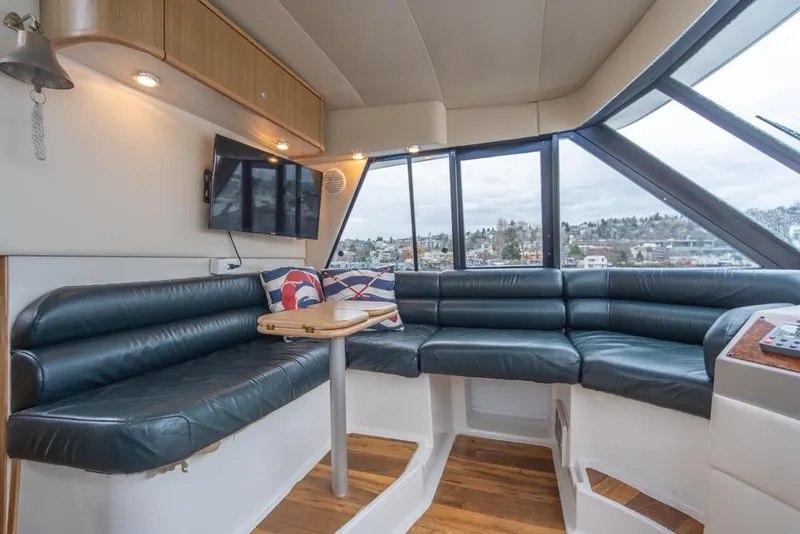 Slide: The Image of Interior of 2000 Bayliner 4788 Pilot House Motoryacht with leather seating and panoramic windows. - 39