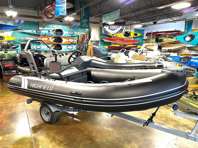 The Image of 2025 Highfield Classic 400 inflatable boat in showroom with kayaks and equipment. - 0