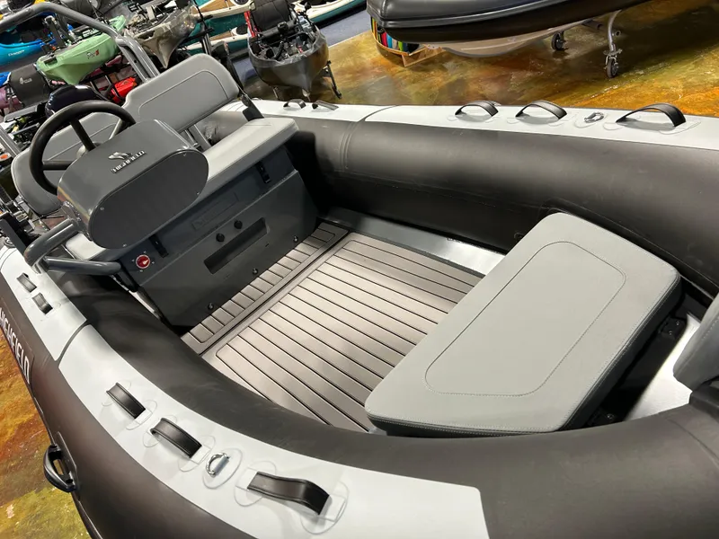 Slide: The Image of 2025 Highfield Classic 400 inflatable boat interior with seating and steering console. - 10