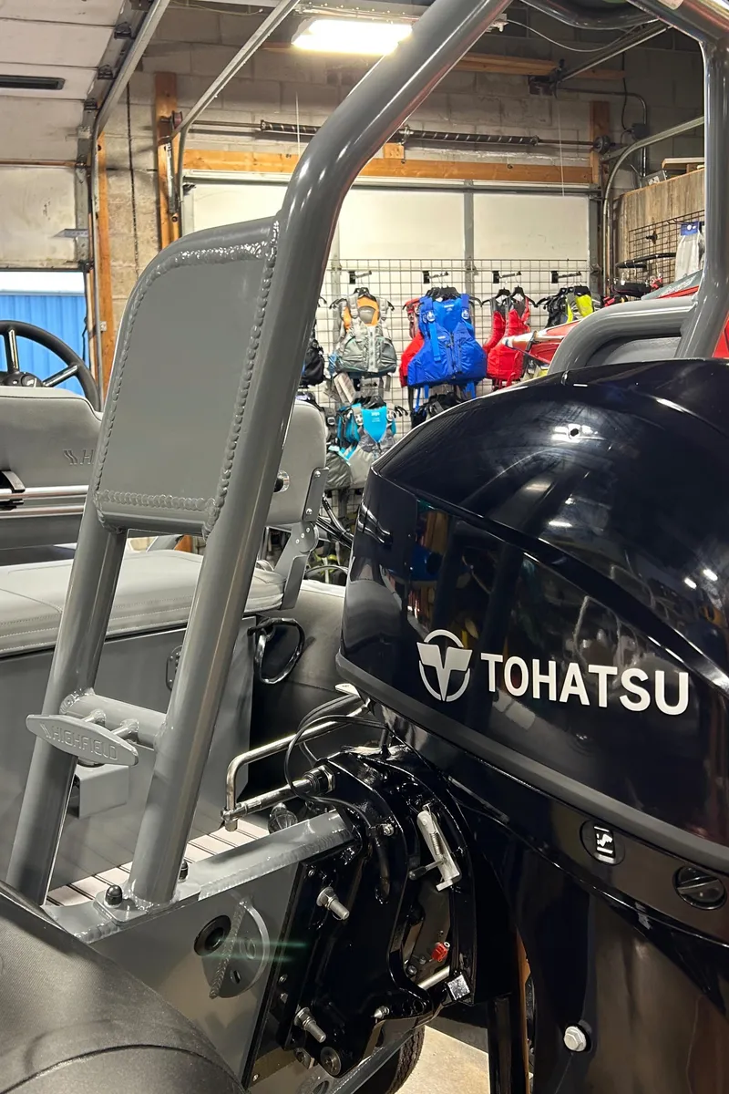 Slide: The Image of 2025 Highfield Classic 400 with Tohatsu engine in a showroom. - 13