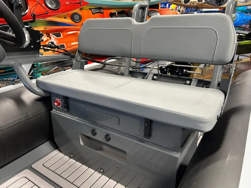 Slide: The Image of 2025 Highfield Classic 400 boat interior with gray seating and storage compartment. - 4