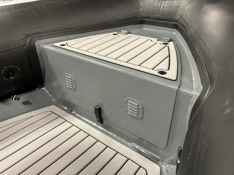 Slide: The Image of Highfield Classic 400 boat interior, 2025 model, featuring sleek storage compartment and deck. - 6