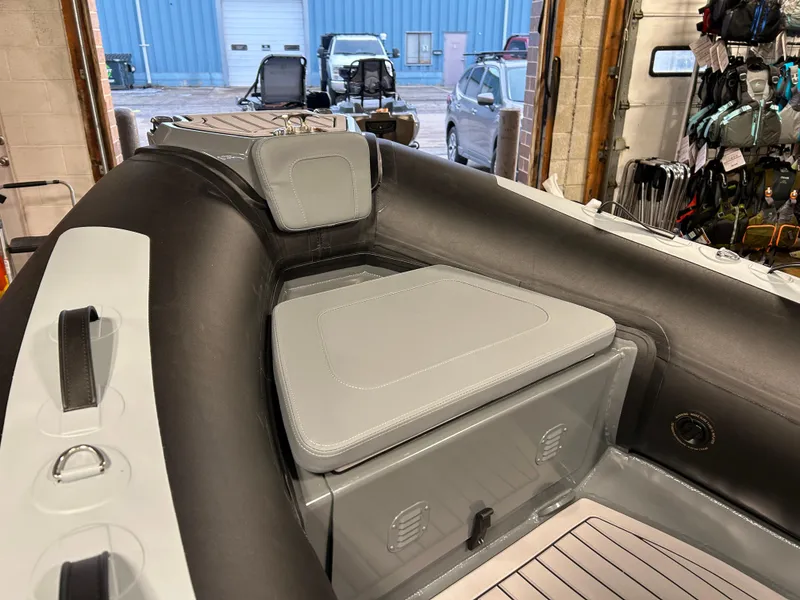 Slide: The Image of Highfield Classic 400 boat interior, 2025 model, featuring cushioned seating and storage compartment. - 7