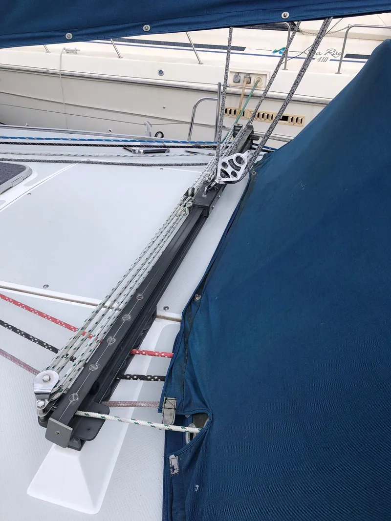 Slide: The Image of Sailboat rigging on a 1996 Catalina 42 MkII with blue canvas cover. - 23