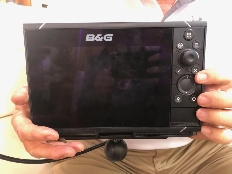 Slide: The Image of B&G marine navigation device held by a person, Catalina 42 MkII, 1996 model. - 25