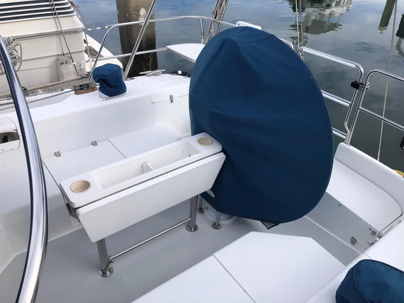 Slide: The Image of 1996 Catalina 42 MkII yacht cockpit with covered steering wheel and seating area. - 27