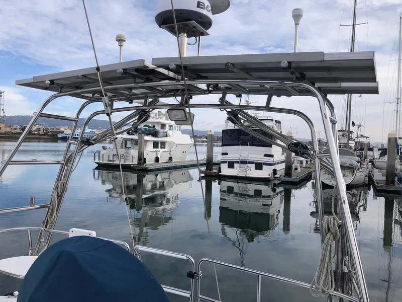 Slide: The Image of 1996 Catalina 42 MkII sailboat docked in a marina with solar panels. - 28