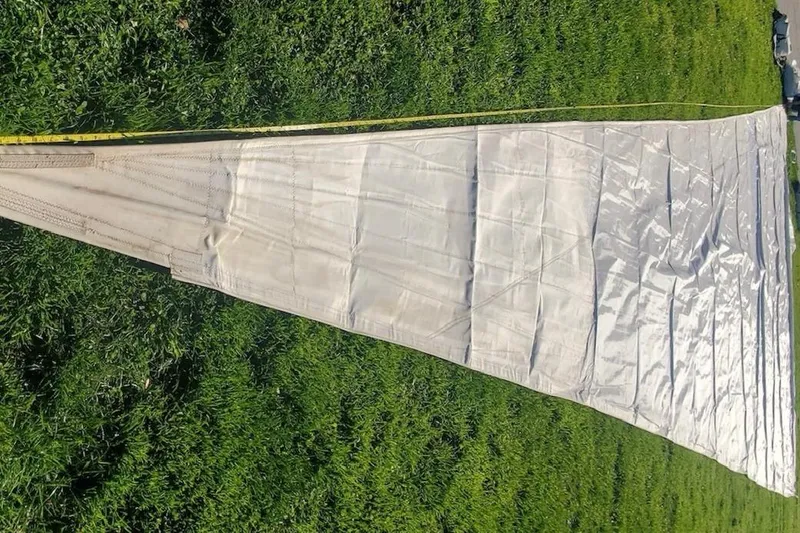 Slide: The Image of Sail from a 1996 Catalina 42 MkII laid out on grass. - 37