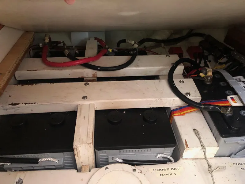 Slide: The Image of Battery compartment of a 1996 Catalina 42 MkII sailboat, showing multiple batteries and wiring. - 38
