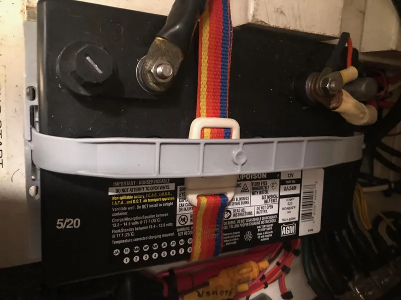 Slide: The Image of Catalina 42 MkII 1996 boat battery secured with colorful strap. - 39