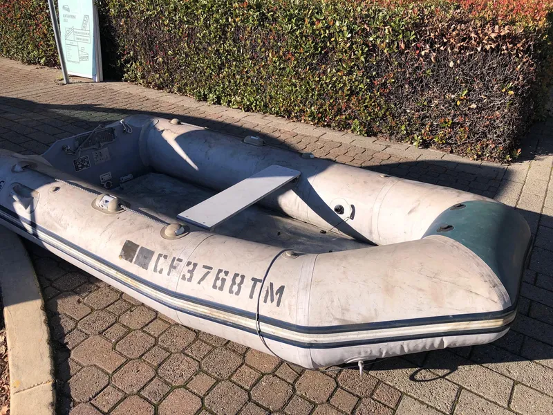 Slide: The Image of Inflatable dinghy on pavement, associated with 1996 Catalina 42 MkII. - 42