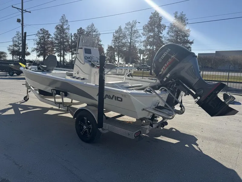 Slide: The Image of Avid FS 2021 boat with Yamaha outboard motor on a trailer in a sunny outdoor setting. - 10