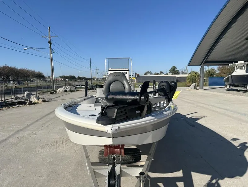 Slide: The Image of 2021 Avid FS boat on trailer under clear blue sky. - 12