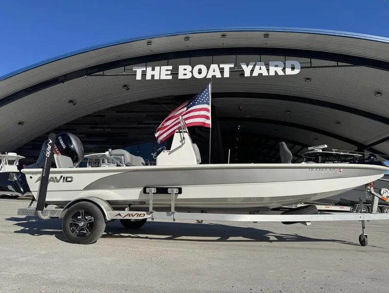 Slide: The Image of 2021 Avid FS boat with American flag at The Boat Yard. - 15