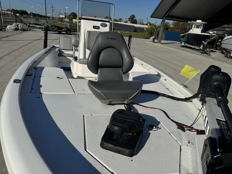 Slide: The Image of 2021 Avid FS boat with seating and control panel, docked outdoors. - 5