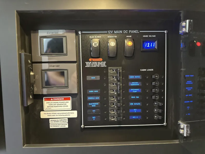 Slide: The Image of 12V main DC panel on 2025 Boston Whaler 380 Realm boat. - 18