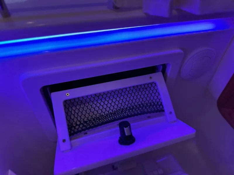Slide: The Image of 2025 Boston Whaler 380 Realm interior detail with blue LED lighting. - 29