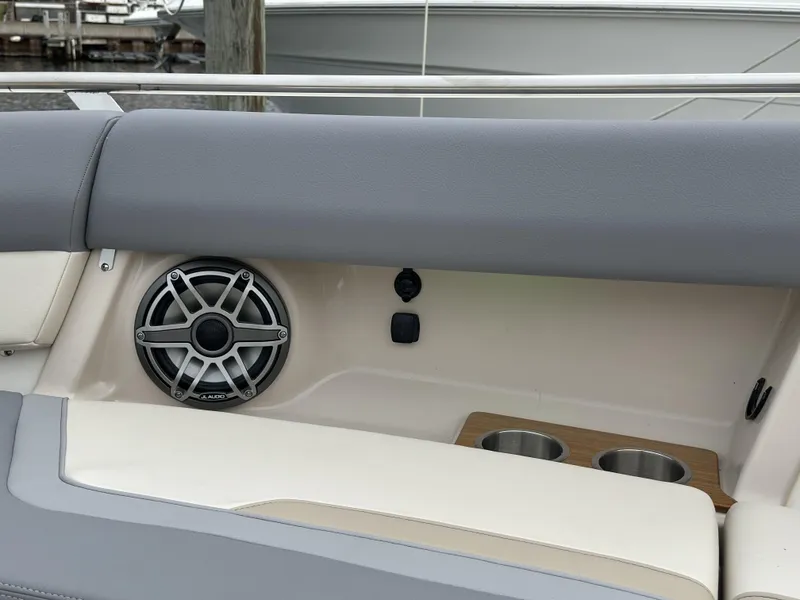 Slide: The Image of 2025 Boston Whaler 380 Realm boat interior with speaker and cup holders. - 34