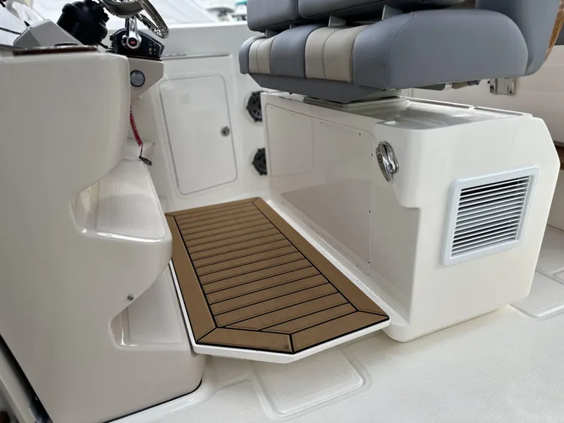 Slide: The Image of Interior view of 2025 Boston Whaler 380 Realm boat, featuring seating and deck area. - 42